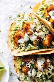 Build the tacos, place a slice of redfish in the taco, (most restaurants use 2 tortillas at one time , it's up to you, the corn can be a bit brittle but i love the flavor of the corn with the fish. Spicy Shrimp Tacos With Garlic Cilantro Lime Slaw Recipe Pinch Of Yum