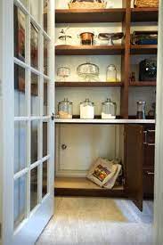 Pantries typically hold groceries, but no one says you can't squeeze in a few platters, small appliances, and baskets to hold linens, paper goods, and cleaning supplies. Small Door To Garage So Groceries Can Be Unloaded From Car And Pushed Thru To Pantry Kitchen Design Small Space Kitchen Pantry Design Small Doors