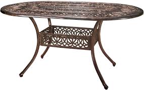 Encircling a sleek pool, this garden for a growing family offers comfortable spaces in which to play, relax and dine. Christopher Knight Home Tucson Cast Aluminum Dining Table Shiny Copper Garden Outdoor Amazon Com