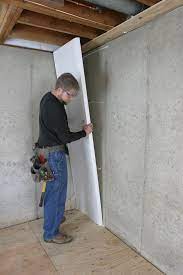 How To Finally Turn Your Unfinished Basement Into A Real Living Space Insulating Basement Walls Basement Insulation Unfinished Basement