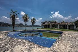 The pink mansion where the drug kingpin lived has been razed from the waterfront plot of land. Paintballing In Pablo Escobar S Mansion Aram Balakjian