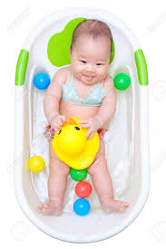 Duckling video duckling funny video duckling. Asian Baby Girl Taking A Bath In White Tub And Playing Duck And Have Different Color Of Plastic Balls Stock Photo Picture And Royalty Free Image Image 42651147