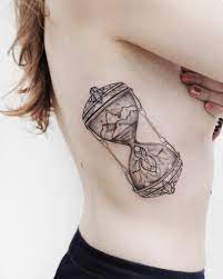 Hourglass Tattoo On The Right Rib Cage Ribcage Tattoo Tattoos Jewelry Tattoo