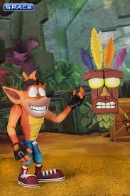 He is a witch doctor spirit who now lives as a wooden mask who guides crash , his sister coco and their friends as they defeat the forces of evil. Ultra Deluxe Crash With Aku Aku Mask Crash Bandicoot