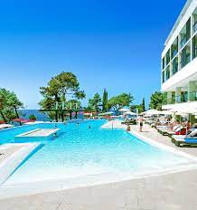 Their picture windows open towards large terraces. Kroatien Kroatien Urlaub Laguna Parentium Hotel Pool Pool Mit Meerblick Hotel Direkt Am Strand Hotel Tipps Hot Kroatien Urlaub Ferien In Kroatien Kroatien