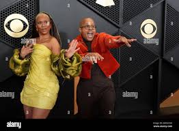 Jean Baylor, left, and Marcus Baylor of The Baylor Project arrive at the  66th annual Grammy Awards