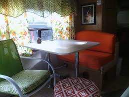 Removed One Bench Seat Replaced It With A Small Chair Recovered The Other Dinette Seat Love It Vintage Camper Interior Remodeled Campers Dinette