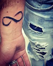 Top 41 Best Infinity Tattoos 2020 Inspiration Guide In 2020 Infinity Tattoos Infinity Tattoo Designs Infinity Tattoo With Feather