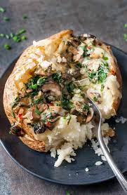 Cheesy Vegetarian Loaded Baked Potatoes With Spinach And Mushrooms Recipe Loaded Baked Potatoes Baked Potato Spinach Stuffed Mushrooms