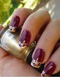 Create snowflakes with white polish and add a few rhinestones for a fabulous effect. 30 Burgundy Nails Burgundy Nail Color Ideas