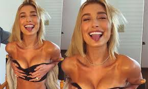 Hailey Baldwin sticks out her tongue while grabbing her breasts | Daily  Mail Online
