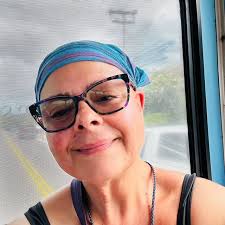 Per person, but if one person is getting stuck with an objectively worse  room, I would suggest to the group we each pay a little more so they can  pay less