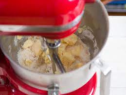 Transfer the dough ball to the bowl of a kitchenaid stand mixer fitted with a paddle attachment, or to a large mixing bowl if you are using a hand mixer. How Stand Mixers Work