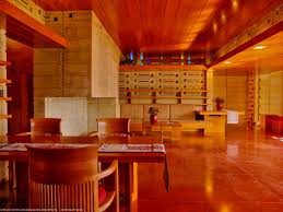 Usonian Faculty House Dining Table In Foreground Floating Fireplace Built In Sofa With Perforated Textile Built In Couch Built In Sofa Floating Fireplace
