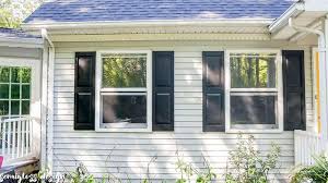 Two styles of black shutters are used to complement the. The Lazy Girl S Guide On How To Paint Shutters To Improve Curb Appeal