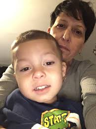 Madonna photographed with dancers Erikah Belle and brother Christopher  Ciccone after performing "Holiday"