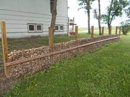 For more on this read a wire cage nightmare. Retaining Wall Made From 4x6 Treated Wood Concrete Mesh Lined With Chicken Wire Then Filled It In With Landscape R Landscape Rock Retaining Wall Concrete Mesh