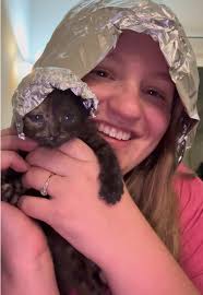 Lunch is served! Sgt. Garo Brown bottlefeeding a tiny kitten is the co...