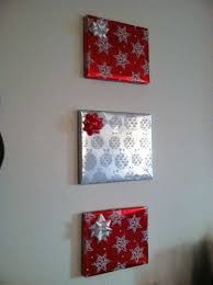 Diy christmas wall decorations with wrapping paper. Wrap Frames Or Mirrors That Hang On The Wall All Year Round In Christmas Wrapping Paper To Add To Office Christmas Decorations Paper Wall Hanging Christmas Diy