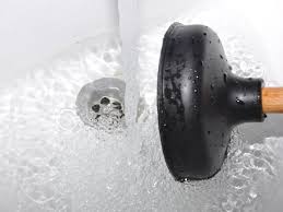 A sink plunger and a drain auger. How To Clear Any Clogged Drain Tools And Tips This Old House