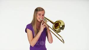The story of a trombone: Woman Model In Studio With White Background Playing Trombone Youtube