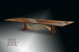 It has a round top with a simple apron and accommodates 4 persons. Steel Tai Chi Rare Wood Slab Dining Table Jeffrey Greene