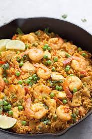 A Simple To Make Paella Using Brown Rice Chicken Shrimp Turmeric And Tons Of Flavor Perfec Shrimp Recipes Healthy Chicken And Shrimp Recipes Paella Recipe