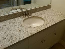 Giallo ornamental granite with off white cream distressed finished hickory cabinets, creamy gray natural travertine tumbled subway picture credit: Giallo Cream Granite Slab Suwanee Atlanta Johns Creek Georgia Giallo Ornamental Granite
