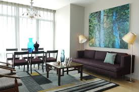 Grey and blue living room with dark wall. Brown And Blue Interior Color Schemes For An Earthy And Elegant Room