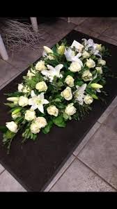 A wide variety of white funeral flowers options are available to you, such as material, occasion, and application. Classic White Rose White Lily Casket Spray Regency Flowers Crayford Kent