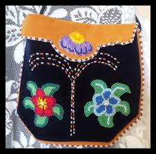 Soft soled beaded leather moccasins with floral patterns and images of birds on the cuff native american; Craftermath The Art Of Metis Beading Ontario Metis Family Records Center