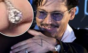 The engagement ring Johnny Depp gave Amber Heard was 'too big for her so he  started wearing it' himself