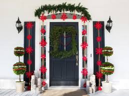 There are plenty of ways to deck the halls (and everything else) that extend beyond spun glass transform your front door into a christmas present with the wide ribbon and an oversized bow. Outdoor Holiday Decorations Hgtv