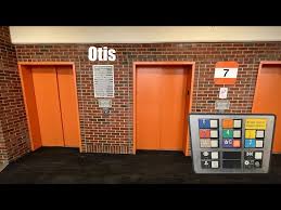 Glass Otis Traction Elevators at the Forest Park Garage