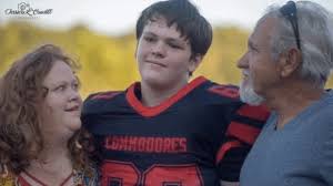 Knott County football player Aaron Crawford was helping flood victims when  he started feeling poorly and then passed away