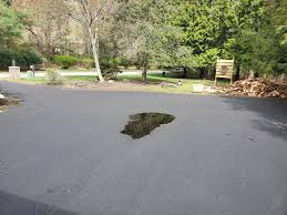 That pile of asphalt to either side of me? Large Puddle In Brand New Driveway Doityourself Com Community Forums
