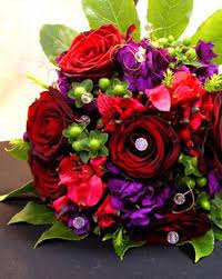 Wedding flower arrangements go beyond the basic centerpieces and bouquets. Pretty Red And Purple Purple Wedding Flowers Red Bouquet Wedding Red Wedding Flowers
