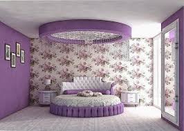 A striped bedroom with aqua curtains, a crystal chandelier and a purple upholstered bed plus purple pillows for a color statement. Purple Color Room Design Ksa G Com