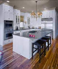 Check spelling or type a new query. White Kitchen Cabinetry Does Not Mean Bland Small Kitchen Layouts Kitchen Layout Kitchen Island With Stove