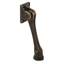 This solid door blocker is metal with a brass finish, and includes the fasteners for installation from the home. Prime Line 4 Kick Down Doorstop At Menards