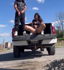 Couple pisses off back of pickup together shorts - ThisVid.com