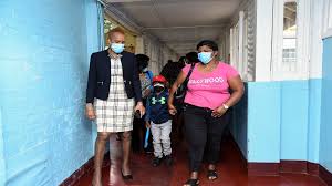 Boy mauled by dogs last year meets with education minister