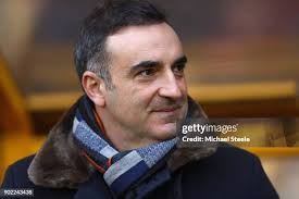 Swansea and Wolverhampton players applaud in tribute to John Hendley...  News Photo