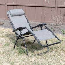 It has a removable headrest, a nice side table with two cup holders, and slots to store a book or tablet and your phone. Sunjoy Zero Gravity Chair Review Relax Under The Sun