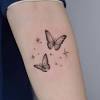 Black silhouette flying birds tattoo on wrist. 1