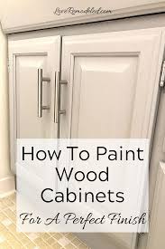 How To Paint Oak Cabinets Without The Grain Showing Painting Oak Cabinets Oak Cabinets Wood Cabinets