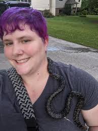 Snake moving backwards to catch a frog