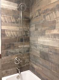 Very Rustic Shower With The Wood Looking Porcelain Tiles On The Walls We Have Many Wood Types And Colors In Ou Shower Tile Wood Tile Shower Farmhouse Shower