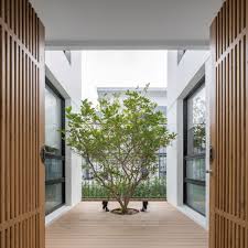 The house opens through glass walls and sliding doors to the garden and let a lot of light inside. Multiple Courtyard House Poetic Space Studio Arch2o Com