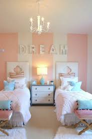 By tucking the beds into a corner, you'll free up plenty of floor space. Twin Bedroom Ideas Boy Girl Design Corral